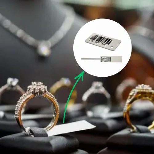 RFID jewellery tag attached to a diamond ring for inventory tracking